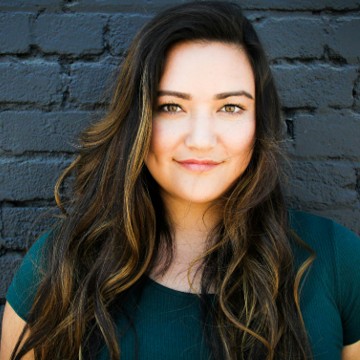 A portrait of a woman standing, by Hannah Nelson