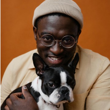 A portrait of a man holding his dog, by  SHVETS production